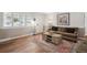 Cozy living room with hardwood floors, neutral paint colors, and stylish decor at 1774 S Dover Way, Lakewood, CO 80232