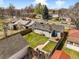 A fenced backyard with green grass, patio area, a small shed, and outdoor seating, perfect for entertaining at 4374 S Washington St, Englewood, CO 80113