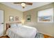 Bedroom with neutral walls and light coming through the window and a ceiling fan at 4374 S Washington St, Englewood, CO 80113
