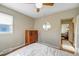 Bedroom featuring hardwood floors, a ceiling fan, and natural light from the window at 4374 S Washington St, Englewood, CO 80113