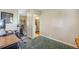 Home office space with hardwood floors and views into the hall and kitchen at 4374 S Washington St, Englewood, CO 80113