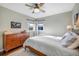Serene bedroom with hardwood floors, natural light, and a comfortable bed at 4374 S Washington St, Englewood, CO 80113