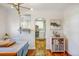 View of dining room open to the kitchen, featuring modern decor and lighting at 4374 S Washington St, Englewood, CO 80113