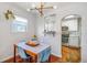 Inviting dining area with hardwood floors and modern lighting, open to the adjacent kitchen at 4374 S Washington St, Englewood, CO 80113