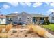 Charming single-story home with a well-maintained front yard and beautiful landscaping at 4374 S Washington St, Englewood, CO 80113