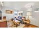 Comfortable living room featuring modern decor, a cozy sectional, and stylish furnishings at 4374 S Washington St, Englewood, CO 80113