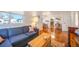 Inviting living room with hardwood floors and a glimpse into the adjacent dining area and kitchen at 4374 S Washington St, Englewood, CO 80113
