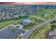 An aerial view of a neighborhood featuring a community pool and well-manicured landscaping at 10387 Harrisburg St, Parker, CO 80134