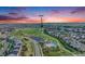 Aerial view of the neighborhood and its amenities including a pool and green spaces at 10387 Harrisburg St, Parker, CO 80134