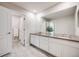 Bright bathroom with double vanity and stone countertops at 10387 Harrisburg St, Parker, CO 80134