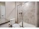 Bathroom boasts updated stone tile shower with glass door at 10387 Harrisburg St, Parker, CO 80134