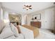 Bright bedroom featuring neutral walls, carpeted floors, ceiling fan, and a dedicated office nook at 10387 Harrisburg St, Parker, CO 80134