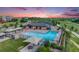Community pool area with lounge chairs, picnic tables, and a clubhouse at 10387 Harrisburg St, Parker, CO 80134