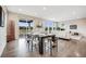 Dining area adjacent to the living room, showcasing an open and inviting layout at 10387 Harrisburg St, Parker, CO 80134
