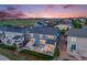 Aerial view of a blue home in a neighborhood, featuring a lawn and deck at 10387 Harrisburg St, Parker, CO 80134