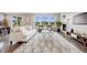 Spacious living room featuring a fireplace, large windows, and stylish furnishings at 10387 Harrisburg St, Parker, CO 80134