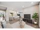 Comfortable living room with hardwood floors, neutral paint, and an adjacent dining area and kitchen at 10387 Harrisburg St, Parker, CO 80134