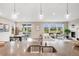 Open concept living area featuring a spacious layout, fireplace, and bright windows with neighborhood views at 10387 Harrisburg St, Parker, CO 80134