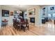 Cozy dining room with hardwood floors, fireplace, and chandelier at 23503 E Minnow Dr, Aurora, CO 80016