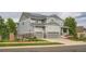 Attractive two-story home with a two-car garage, solar panels, inviting porch, and well-maintained landscaping at 23503 E Minnow Dr, Aurora, CO 80016