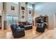 Spacious living room featuring high ceilings, large windows, and hardwood floors at 23503 E Minnow Dr, Aurora, CO 80016