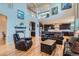 A cozy living room is brightened by natural light and features a fireplace at 23503 E Minnow Dr, Aurora, CO 80016
