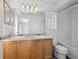 Bathroom features a double sink vanity and a glass block window at 1272 Braewood Ave, Highlands Ranch, CO 80129