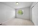 Light-filled bedroom offers a calming view through a window and ample closet space at 1272 Braewood Ave, Highlands Ranch, CO 80129