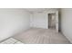 Bright bedroom features neutral carpet, white walls, and access to an ensuite bathroom at 1272 Braewood Ave, Highlands Ranch, CO 80129