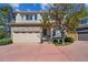 Charming two-story home with a brick facade, two-car garage, and a well-maintained front yard at 1272 Braewood Ave, Highlands Ranch, CO 80129