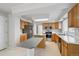 Spacious kitchen with light wood cabinets, stainless steel appliances, and a center island at 1272 Braewood Ave, Highlands Ranch, CO 80129