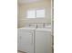 Laundry room area with washer and dryer hookups and shelving for storage at 1272 Braewood Ave, Highlands Ranch, CO 80129