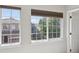 Window view of lush greenery and neighboring homes brings natural light indoors at 1272 Braewood Ave, Highlands Ranch, CO 80129