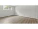 A bright, cozy bedroom with wood-look floors, providing a blank canvas for personalized decor at 7755 E Quincy Ave # 107D2, Denver, CO 80237