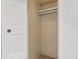 A compact, walk-in closet with a simple rod for hanging clothes, offering practical storage space at 7755 E Quincy Ave # 107D2, Denver, CO 80237