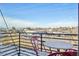 Enjoy clear blue sky views from this charming balcony with a cozy seating area in a vibrant neighborhood at 5531 W 11Th Pl, Lakewood, CO 80214