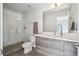 Modern bathroom featuring a glass-enclosed shower, sleek vanity, and neutral color palette at 5531 W 11Th Pl, Lakewood, CO 80214