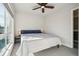 Bedroom with a ceiling fan, and a large window with natural light at 5531 W 11Th Pl, Lakewood, CO 80214