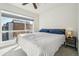 Bright bedroom featuring a large window offering natural light and neighborhood views at 5531 W 11Th Pl, Lakewood, CO 80214