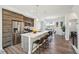 Modern kitchen features a large island with seating and stainless steel appliances at 5531 W 11Th Pl, Lakewood, CO 80214