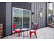 Back patio featuring outdoor seating, modern siding and snow-covered ground at 5531 W 11Th Pl, Lakewood, CO 80214