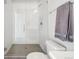 Bright bathroom shower with white subway tile surround and updated fixtures at 5531 W 11Th Pl, Lakewood, CO 80214