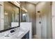 Bathroom with a walk-in shower, gray tile, and a floating vanity at 52 West Point Lode # A, Breckenridge, CO 80424