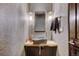 Small bathroom with a unique stone sink and wood accent at 52 West Point Lode # A, Breckenridge, CO 80424