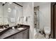 Modern bathroom with gray vanity, a large mirror, and a glass shower at 52 West Point Lode # A, Breckenridge, CO 80424