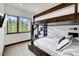 Bedroom with a bunk bed, a window showing mountain views, and a TV at 52 West Point Lode # A, Breckenridge, CO 80424