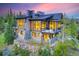 Luxury home with a stone and wood exterior, featuring a large deck at 52 West Point Lode # A, Breckenridge, CO 80424