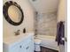 Clean bathroom with a single vanity and bathtub at 3338 S Canosa Ct, Englewood, CO 80110