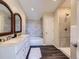 Bathroom boasts a double vanity, tub, and walk-in shower at 3338 S Canosa Ct, Englewood, CO 80110