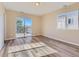 Bright bedroom with wood-look floors and sliding glass door at 3338 S Canosa Ct, Englewood, CO 80110